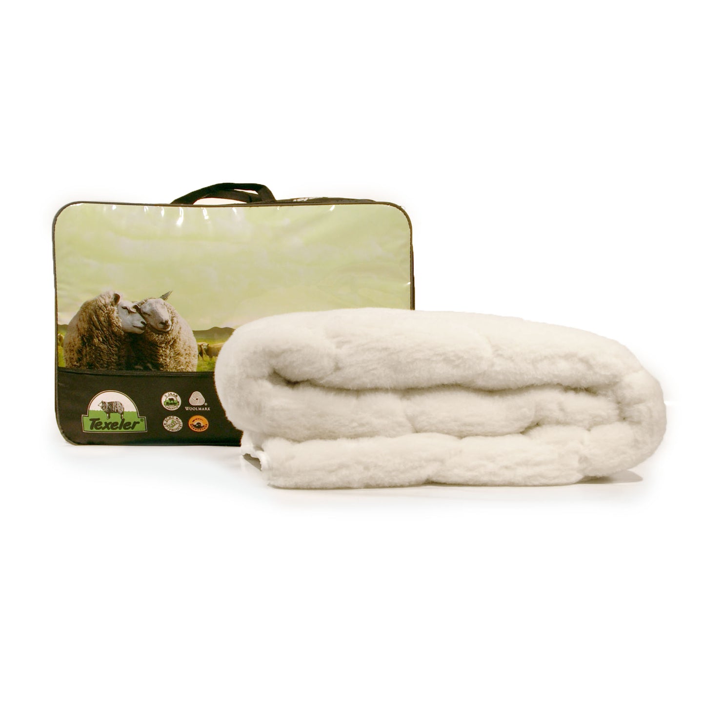 A folded beige Texeler Full wool underblanket with fur finish, with product bag in the back, placed on a white surface