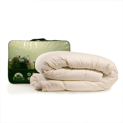 A rolled-up Texeler 'sleep well satin' wool comforter next to its packaging, which features an image of sheep on a green landscape. Beige comforter on a white background