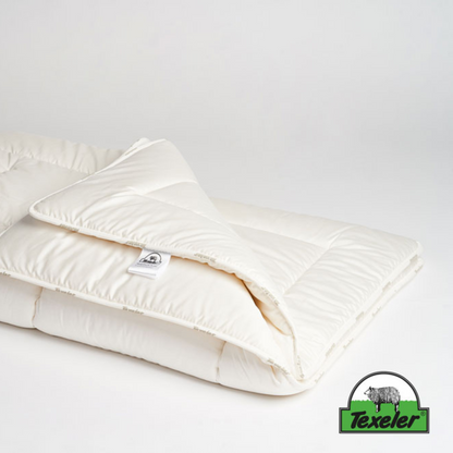 texeler sleep well satin wool comforter laying flat on a white background with the corners folded over. 