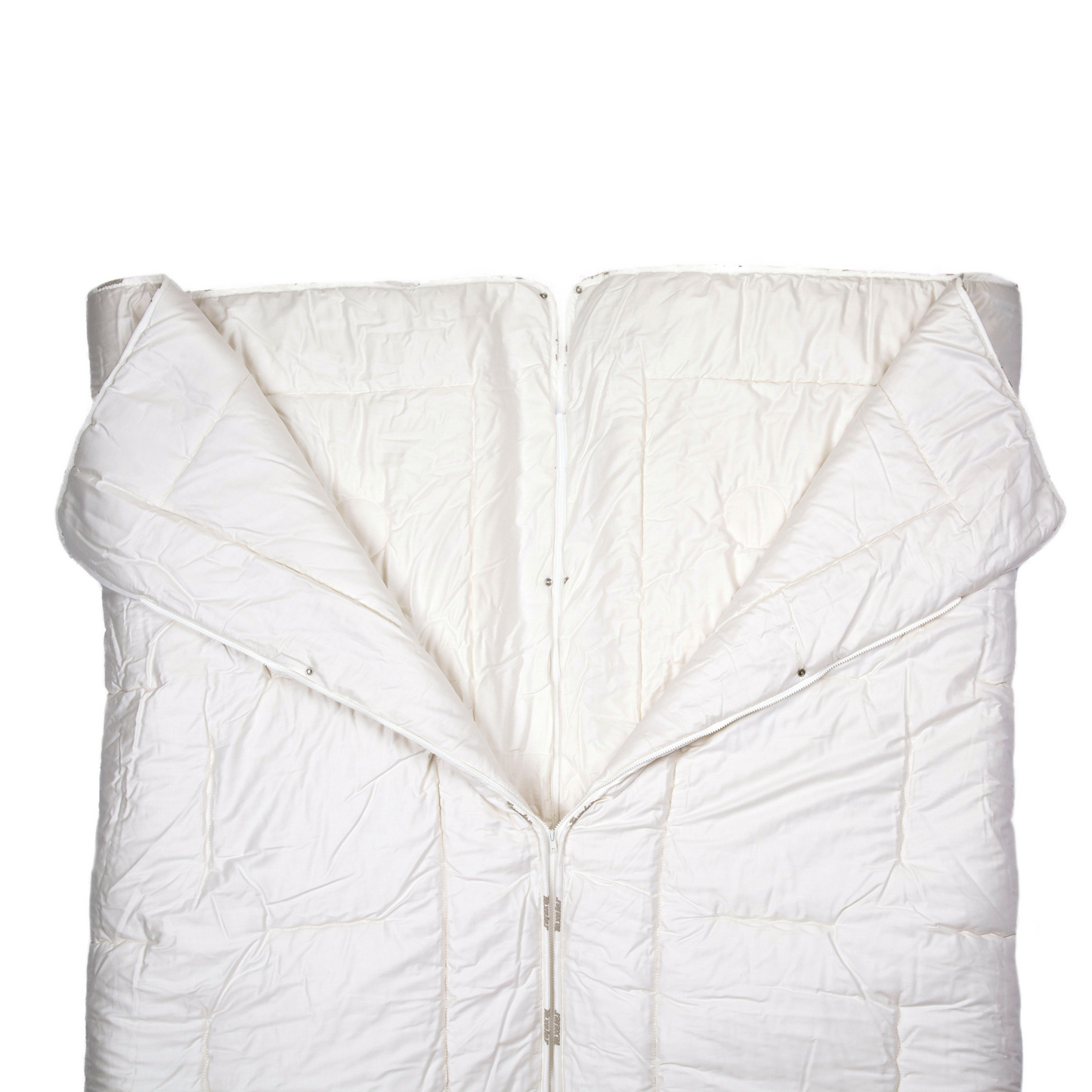 The texeler satin partner wool comforter laying flat while the zipper is undone in the middle to show the function of the comforter. Angle from above.